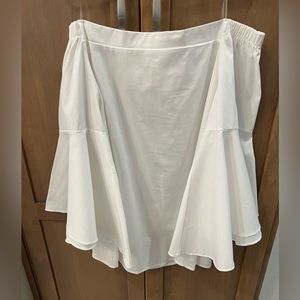 White, off-the-shoulder boutique blouse with flared sleeves.